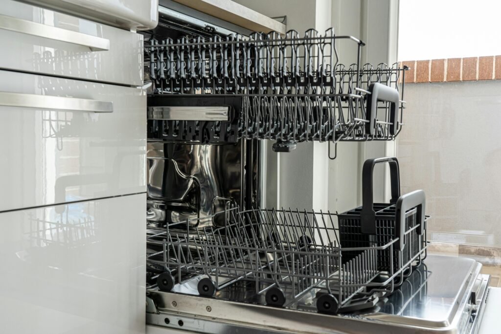 "Open dishwasher with empty racks ready for professional dishwasher repair in Colorado Springs, CO."